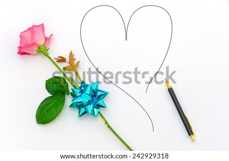 pink rose and a business pen with a heart doodle