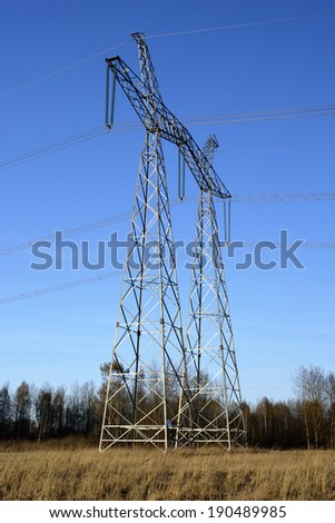 Metal supports of high voltage power lines connecting them with wires