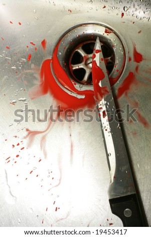 A bloody knife in a stainless steel sink. Evocative of a murder scene, washing the evidence away.