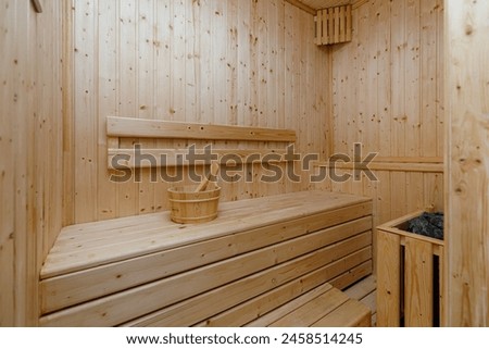 Similar – Image, Stock Photo a wooden sauna from the inside with a man taking a sauna