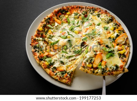 Delicious Pizza with extra cheese Chicken and vegetables