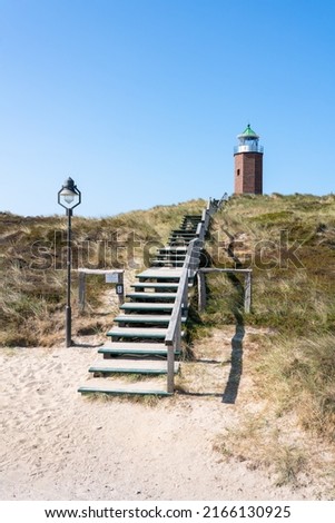 Similar – Foto Bild Rotes Kliff an der Küste der Insel Sylt bei Sonnenuntergang.  Leere Strandkulisse an der Nordsee