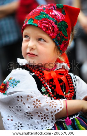 An unidentified young polish girl wearing traditional Lowicz national costume, Corpus Christi procession, Lowicz, Poland, circa June 2013