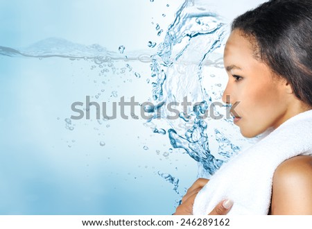 Beauty Woman. Skincare concept. Beauty Face.Perfect Skin. Healthcare. Profile. Beautiful Smiling girl under splash of water with fresh skin over blue background.