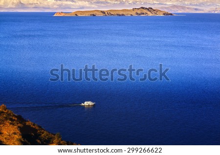 TITICACA LAKE, PERU, BOLIVIA - MAY 28, 2015: View of the Titicaca Lake on the border of Peru and Bolivia. By volume of water, it is the largest lake in South America.