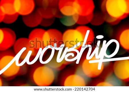 worship word on blurry lights