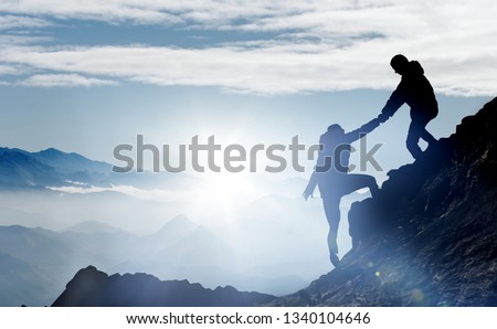 Mountaineers help each other to reach the summit Сток-фото © 