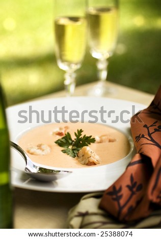 A romantic outdoor meal with lobster bisque and champagne