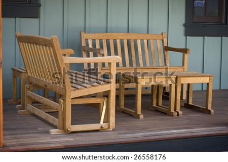 An inviting porch with wooden rocking chairs
