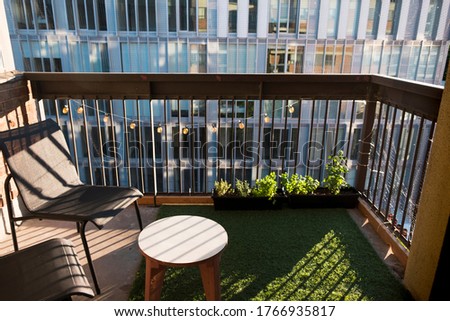 Similar – Image, Stock Photo Shadows of modern balconies over a stone facade at the afternoon light