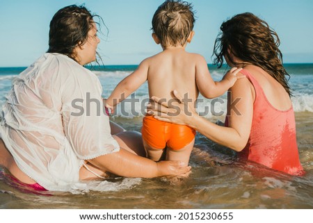 Image, Stock Photo Anonymous tender homosexual couple hugging on street