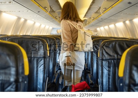 Similar – Image, Stock Photo Anonymous female with luggage walking in empty airport