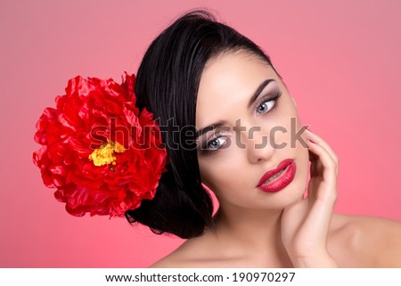Beauty Portrait. Beautiful Stylish Girl with rose Flower. Perfect Face Skin