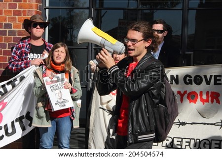 BRISBANE, AUSTRALIA - JULY 12 : Unidentified anti government protesters outside Liberal National Party national conference July 12, 2014 in Brisbane, Australia