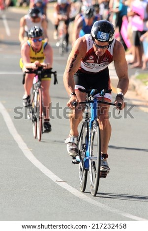 MOOLOOLABA, AUSTRALIA - SEPTEMBER 14 : Unidentified participant in cycle leg of sunshine coast triathlon on September 14, 2014 in Mooloolaba, Australia
