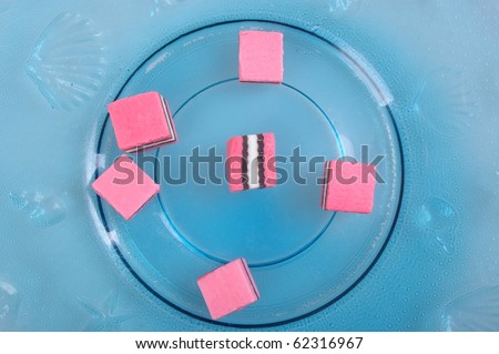 pink white and black licorice on plate