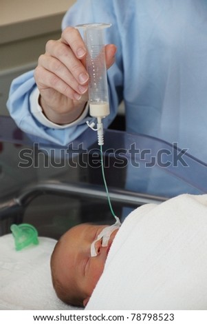 feeding tube being used by premature baby twin