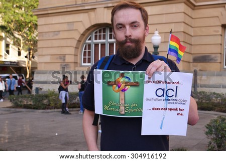 BRISBANE, AUSTRALIA - AUGUST 8 2015:Anti-conservative church christians with sign at Marriage Equality Rally August 8, 2015 in Brisbane, Australia