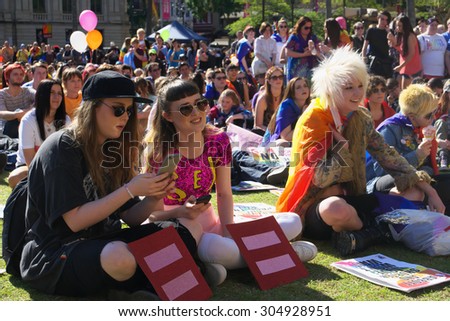 BRISBANE, AUSTRALIA - AUGUST 8 2015: Crowds gathered to listen to speakers at Marriage Equality Rally August 8, 2015 in Brisbane, Australia
