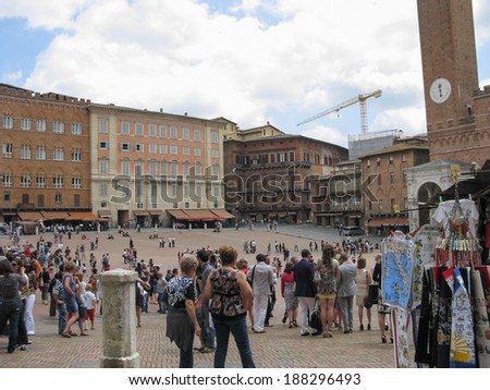 SIENA, ITALY - JUNE 02, 2012: Tourists visiting the ancient city center