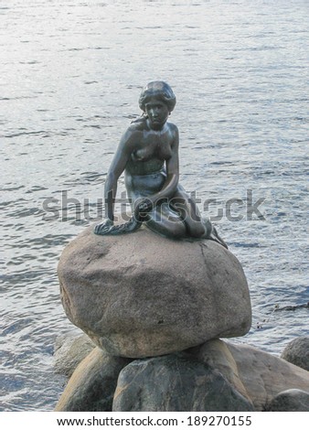 COPENHAGEN, DENMARK - AUGUST 20, 2013: The statue of the Little Mermaid is landmark in Copenhagen in Denmark