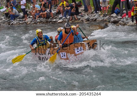 CESANA, ITALY - JULY 06, 2014: Carton Rapid Race is an amateur sport competition for ships made of cardboard on Dora Riparia river