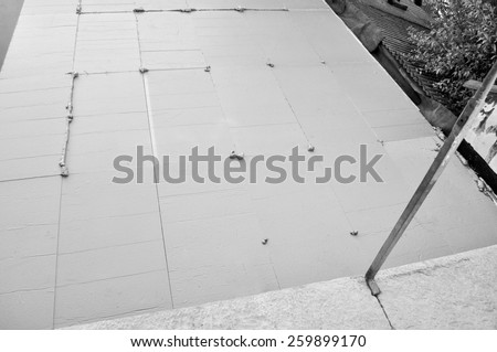 Thermal Insulation of flat roof with insulation boards in black and white