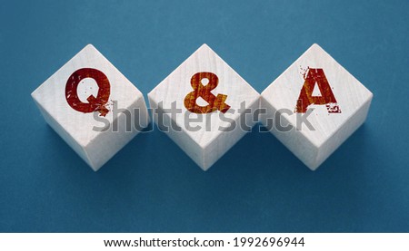 Q and A on wooden blocks Close-up Shot . Question and answers support center business concept. Stock foto © 