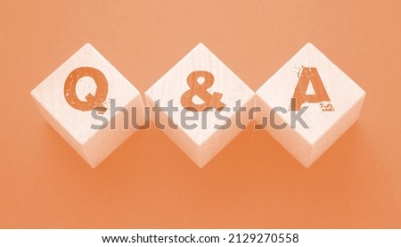 Q and A on wooden blocks Close-up Shot . Question and answers support center business concept. Stock foto © 
