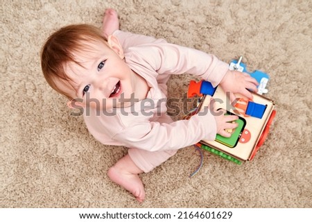 Similar – Image, Stock Photo Toddler playing with toy