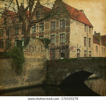 A piece of old architecture in  Bruges, Belgium. Photo in retro style. Added paper texture.