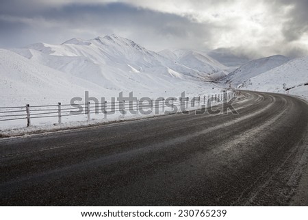 Empty mountain road on a cloudy winter day. South Island, New Zealand