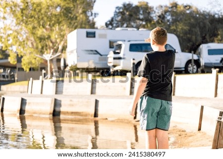 Similar – Boy walking in water of lake