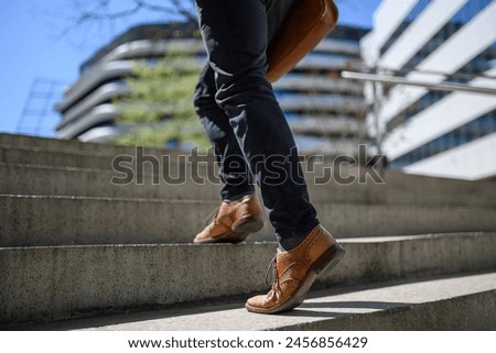 Image, Stock Photo Unrecognizable traveler walking up hill along road