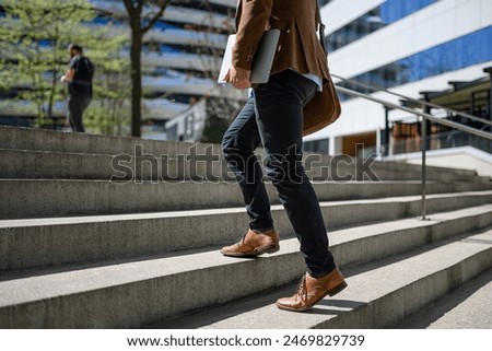 Similar – Image, Stock Photo Unrecognizable traveler walking up hill along road