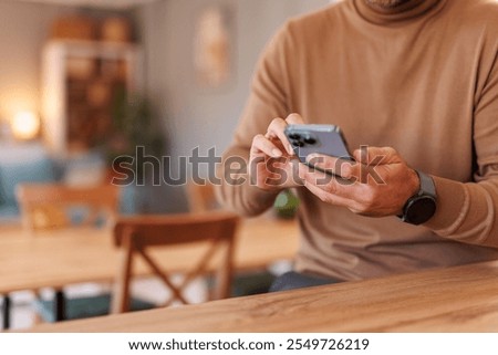 Similar – Image, Stock Photo Crop male entrepreneur browsing cellphone on street