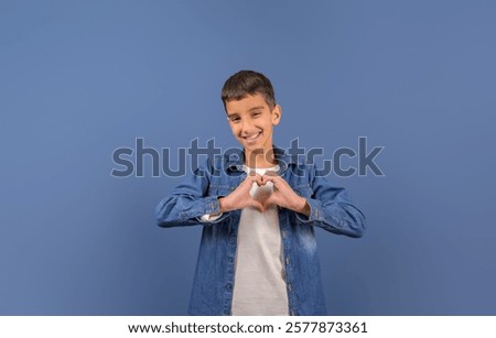 Similar – Image, Stock Photo Young boy is making a wooden  bird house in the carpenter workshop. Curious little sister is trying to see what he is doing behind his back