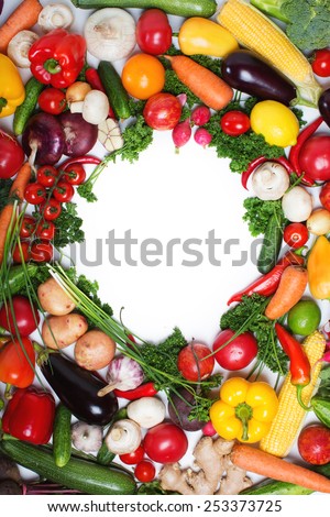 The round frame made of vegetables. Isolated on a white background