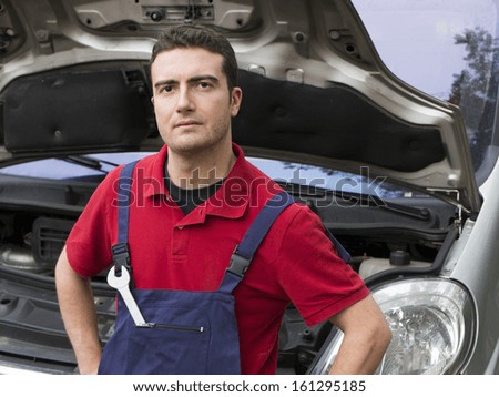 portrait of a mechanic  in auto repair shop