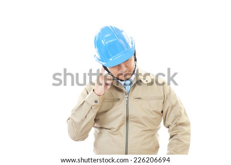 Tired and stressed Asian worker