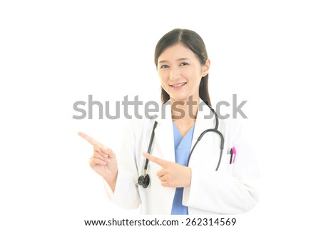Female doctor pointing to her side