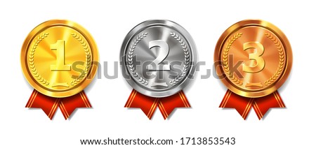 Gold, silver and bronze medals. Champion and winner awards medal set with red ribbon. First place trophy.