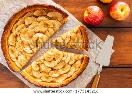 Image, Stock Photo Traditional french apple tart over brown planks