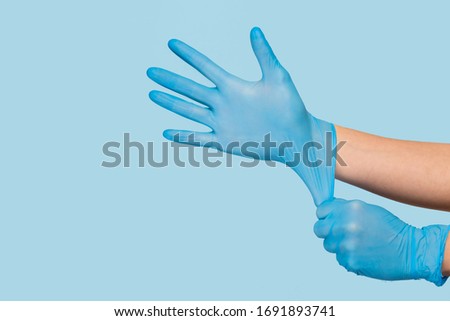 Similar – Image, Stock Photo hands wearing blue gloves holding culture dish