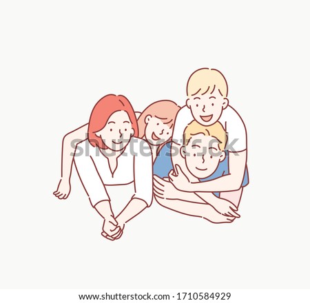 Beautiful and happy smiling young family in white T-shirts are hugging and have a fun time together while lying on the floor and looking on camera. Hand drawn style vector design illustrations.