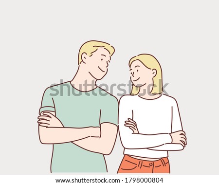 Portrait of a cheerful young couple standing with arms folded and looking at each other. Hand drawn style vector design illustrations.