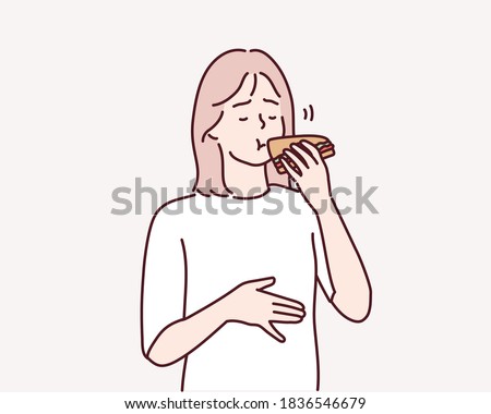 Hungry young woman eating sandwich. Hand drawn style vector design illustrations.