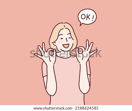 woman is showing a gesture Okay, ok. Hand drawn style vector design illustrations.