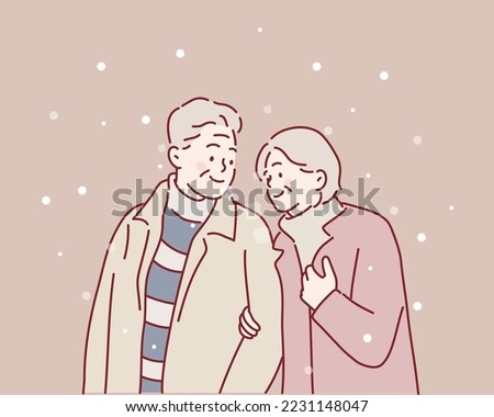 Senior couple walking on the city street at winter day. Hand drawn style vector design illustrations.
