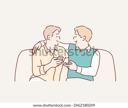 Two friends talking sitting in a couch in the living room. Hand drawn style vector design illustrations.